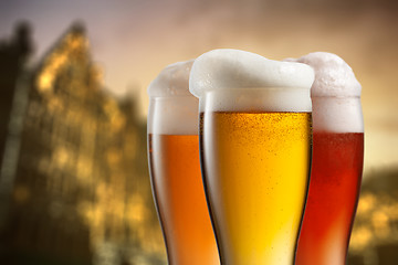 Image showing Glasses of beer against blurred european city