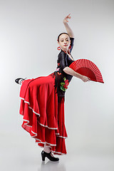Image showing young woman dancing flamenco in red dress on white