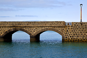 Image showing atlantic ocean lanzarote  bridge and in the blue sky    