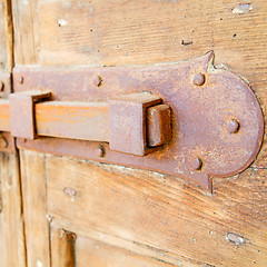 Image showing europe old in  italy  antique close brown door and rusty lock  c