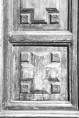 Image showing texture of a brown old door in italy europe