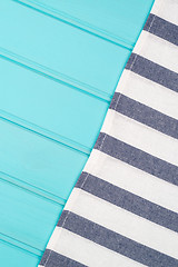 Image showing Blue and white towel over table