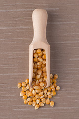 Image showing Wooden scoop with corn