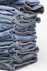 Image showing the heap of modern designer blue jeans