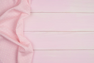 Image showing Pink towel over wooden table