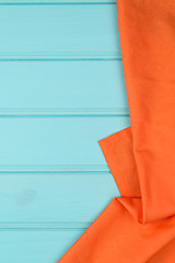 Image showing Orange towel over wooden table