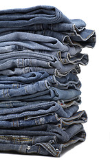 Image showing the heap of modern designer blue jeans