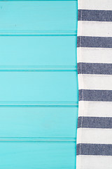 Image showing Blue and white towel over table