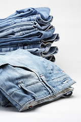 Image showing the heap of modern designer blue jeans