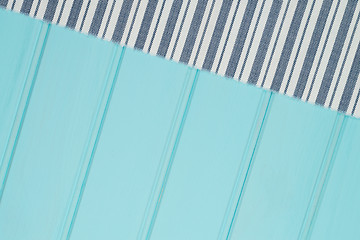 Image showing Blue and white towel over table