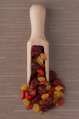 Image showing Wooden scoop with mixed dried fruits