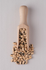 Image showing Wooden scoop with white beans