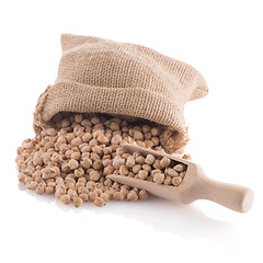 Image showing Uncooked chickpeas and wooden scoop