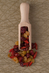 Image showing Wooden scoop with mixed dried fruits