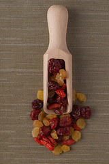 Image showing Wooden scoop with mixed dried fruits