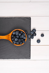 Image showing Blueberries on a wooden spoon