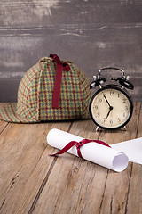 Image showing Wrapped paper sheets and magnifying glass