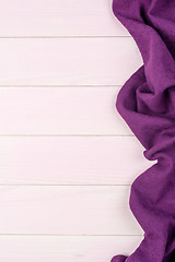 Image showing Purple towel over wooden table