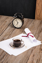 Image showing Old clock, hat, coffee and paper sheets