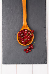 Image showing Currants in a wooden spoon
