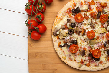 Image showing Pizza with bacon, olives and tomato