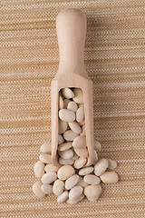 Image showing Wooden scoop with white beans