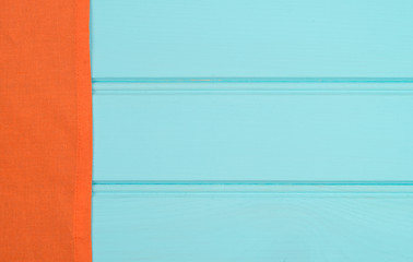 Image showing Orange towel over wooden table