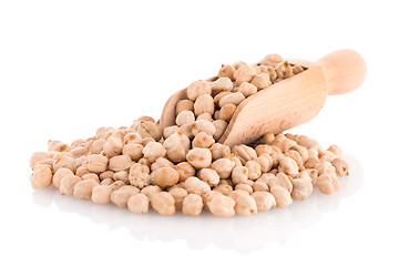 Image showing Uncooked chickpeas and wooden scoop