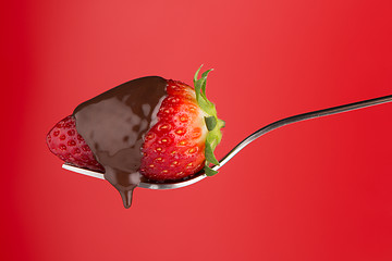 Image showing Strawberry and chocolate on a fork