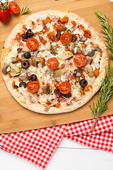 Image showing Pizza with bacon, olives and tomato