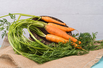 Image showing Carrots on a wooden table