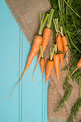 Image showing Carrots on a wooden table