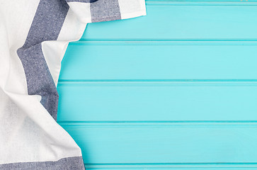 Image showing Blue and white towel over table