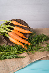 Image showing Carrots on a wooden table