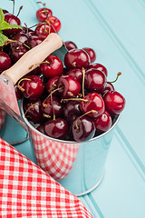 Image showing Cherries in two small metal buckets