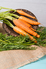 Image showing Carrots on a wooden table