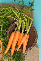 Image showing Carrots on a wooden table