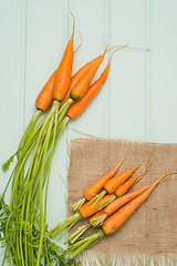 Image showing Carrots on a wooden table