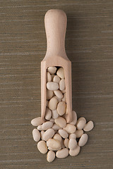 Image showing Wooden scoop with white beans