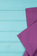 Image showing Purple towel over wooden table