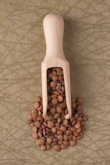 Image showing Wooden scoop with lentils