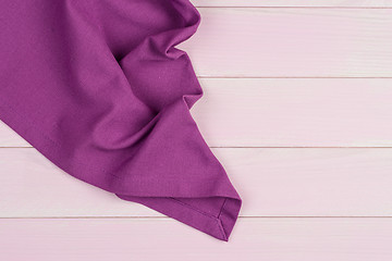 Image showing Purple towel over wooden table