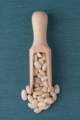 Image showing Wooden scoop with white beans