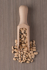 Image showing Wooden scoop with white beans