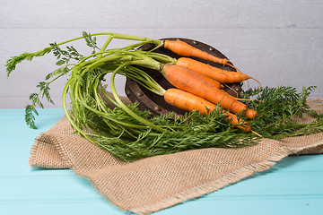 Image showing Carrots on a wooden table