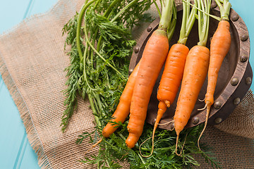 Image showing Carrots on a wooden table