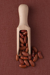 Image showing Wooden scoop with red beans