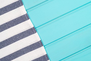 Image showing Blue and white towel over table