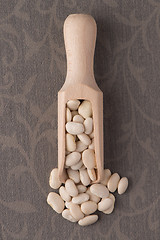 Image showing Wooden scoop with white beans