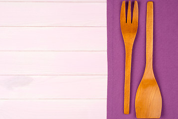 Image showing Kitchenware on purple towel